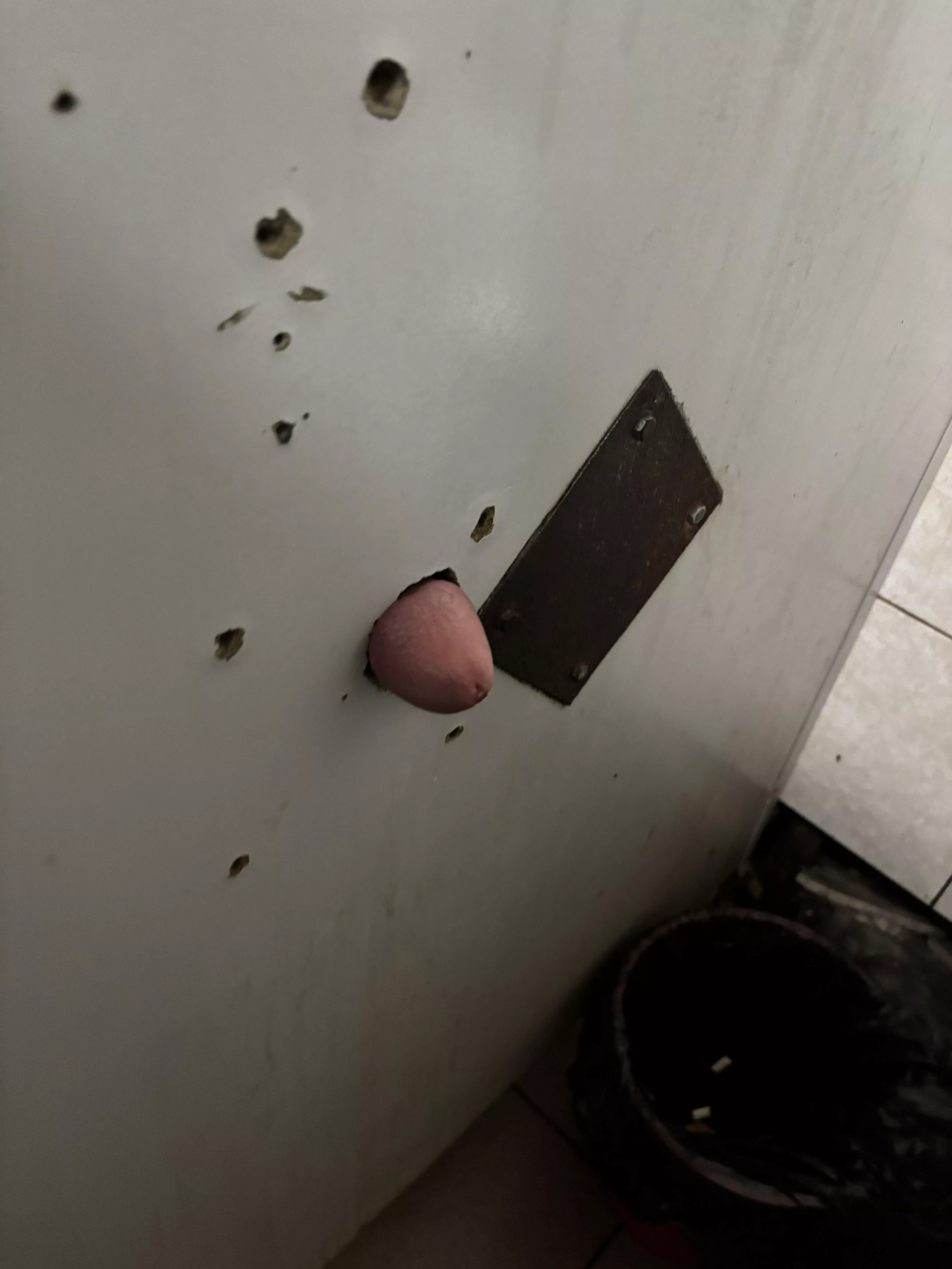 Poking through public gloryhole