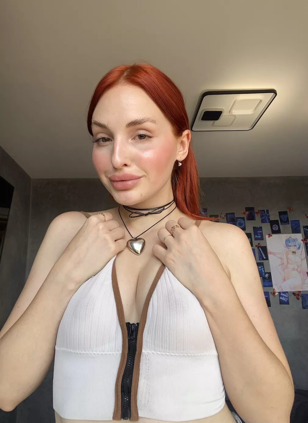 pale skin green eyed redhead, and proud wearing a crop top