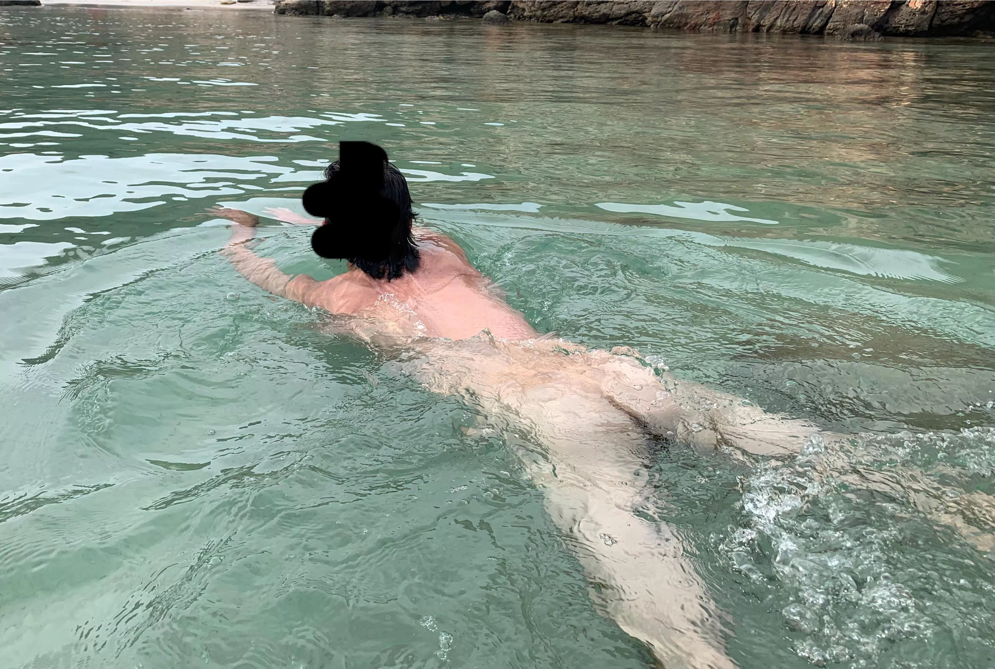 Swimming naked in crystal water