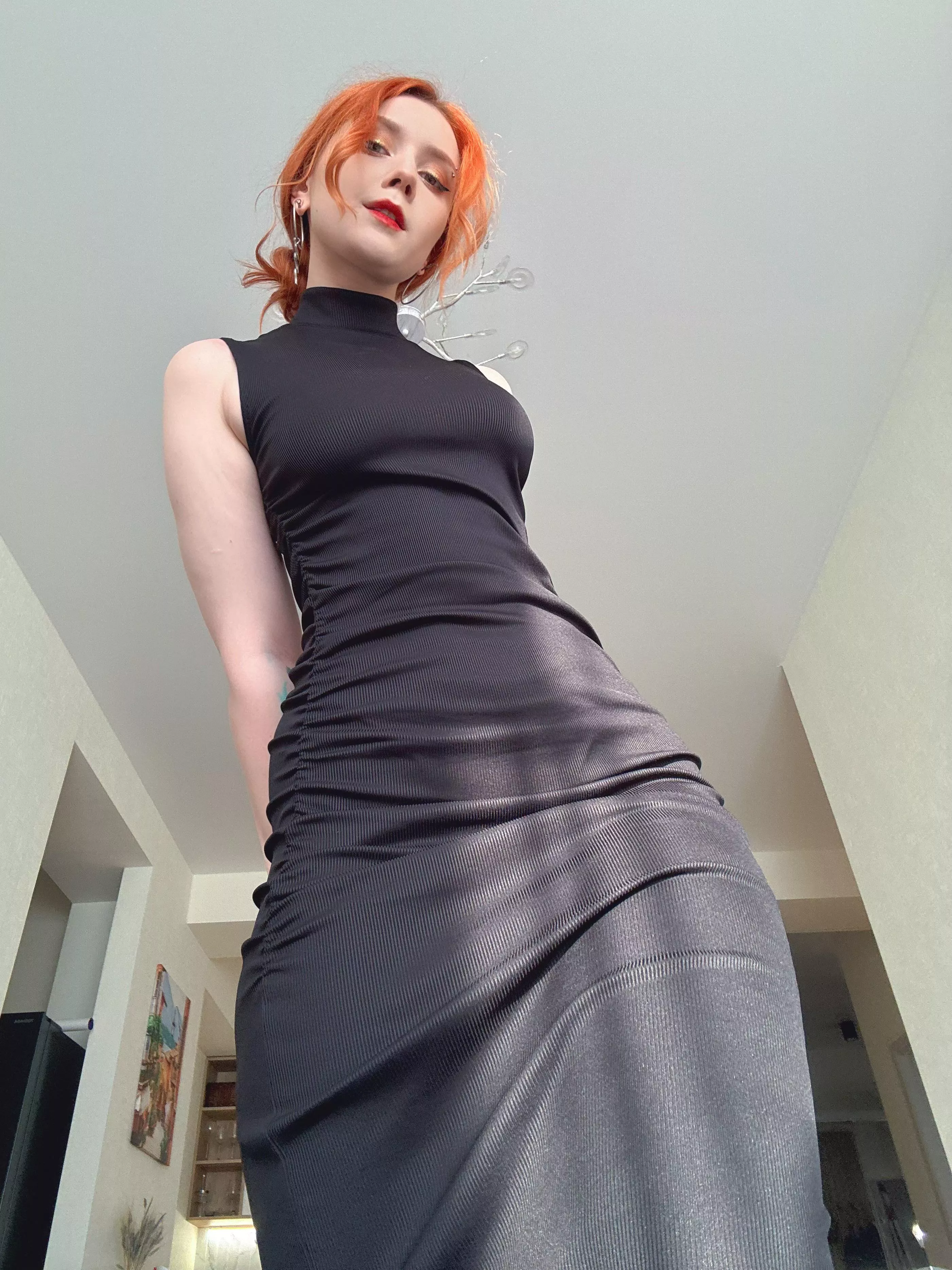 This dress is hugging my curves so tightly, it’s like a second skin