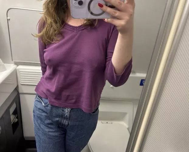 braless airplane selfie 😳✈️
