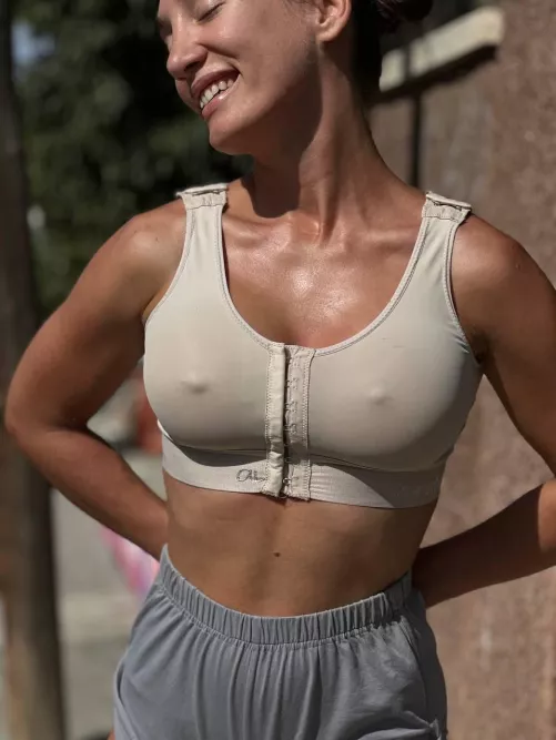Even this tight sports bra can't hide these nipples