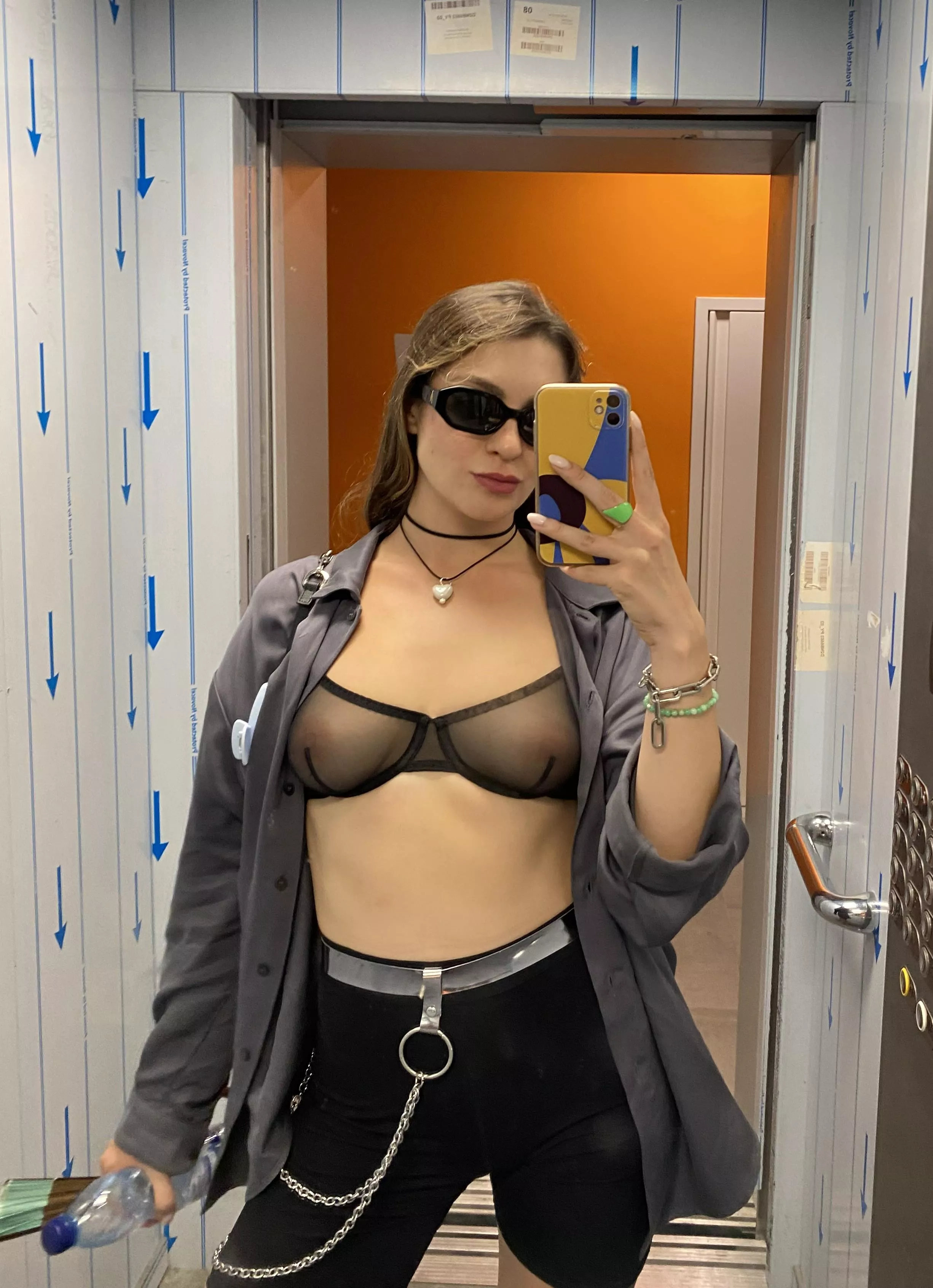 Photo in elevator mirror in seethru bra, open to public