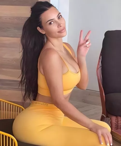 Kim’s gorgeous black hair and perfect tan curves, in her tight gym clothes