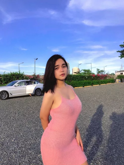 Embracing myself and trying out my new pink dress outside. Does pink look good on me?