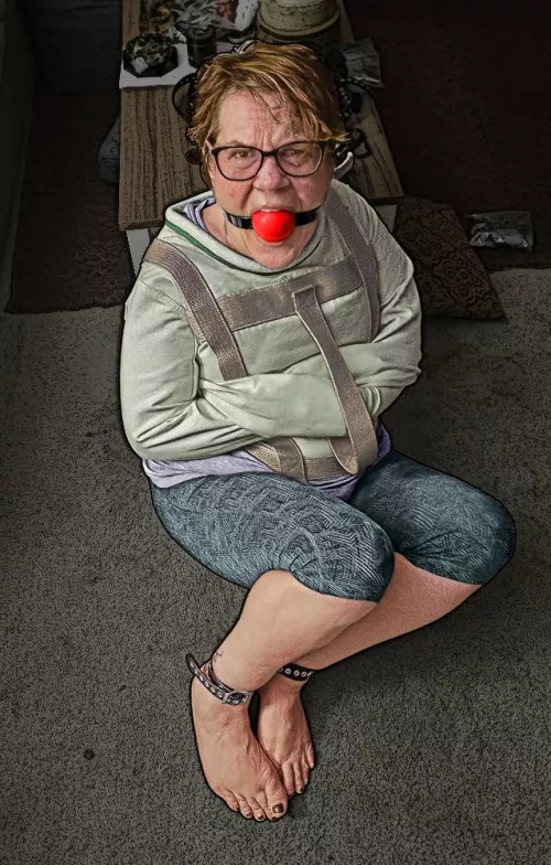 Gagged, straitjacketed, and barefoot; gagtalking non-stop