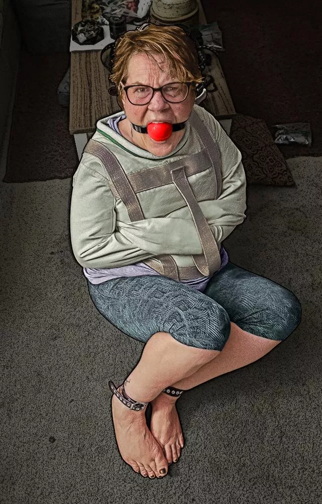 Gagged, straitjacketed, and barefoot; gagtalking non-stop