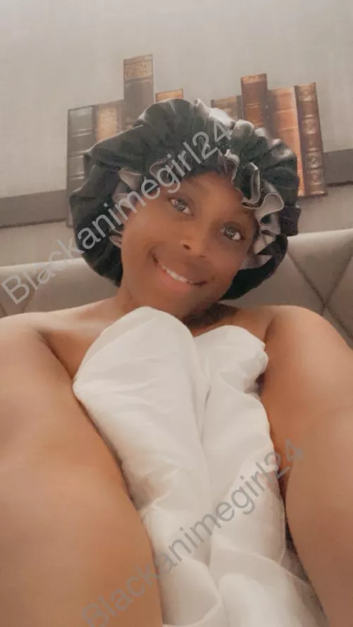 Me chilling in bed. Do you like my hat lol 