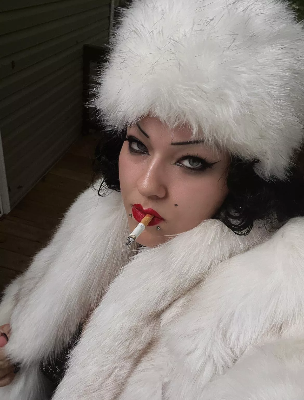 Countess smoking in full furs