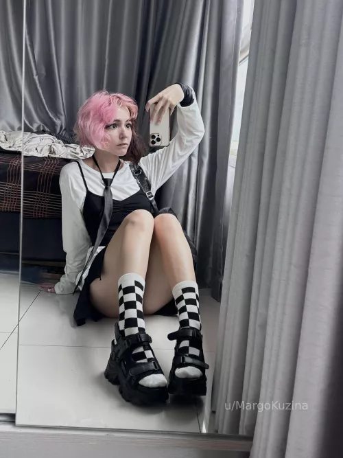 pink-haired figure on a chessboard