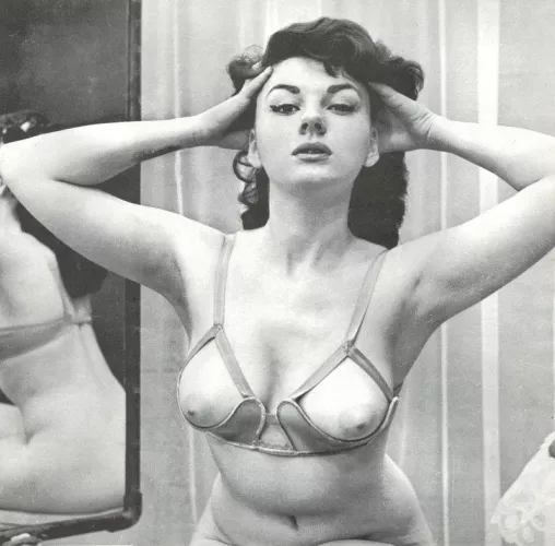 Glenda Graham tries on her special bra [1961]