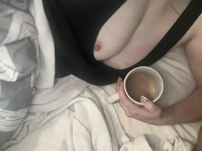 Curled up in bed with my coffee 