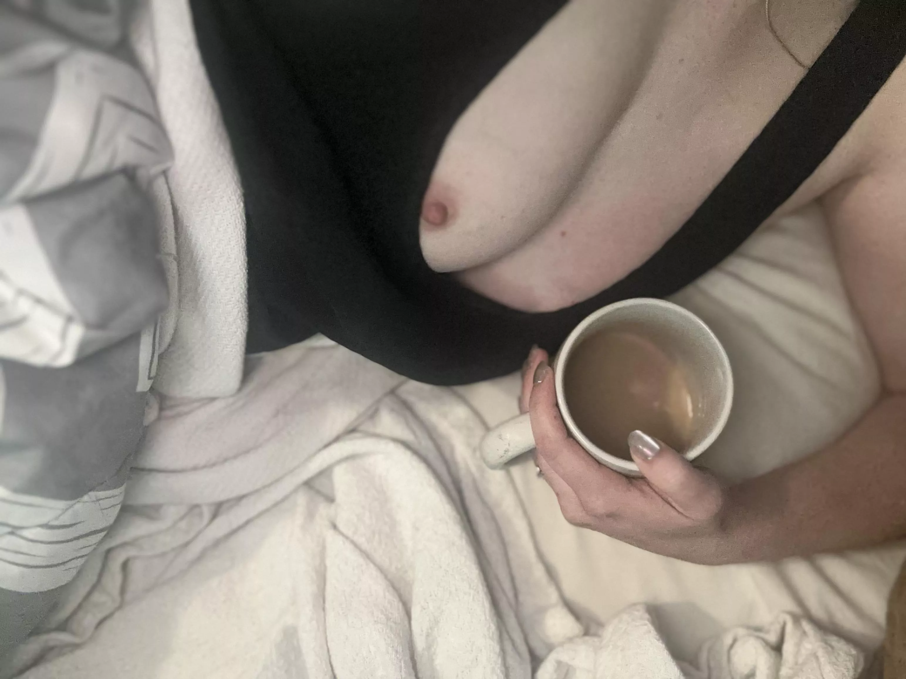 Curled up in bed with my coffee 