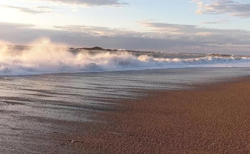 Sandy beach in Turkey and a small wave