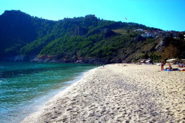 Beach with beautiful golden sand and mountains in Turkey