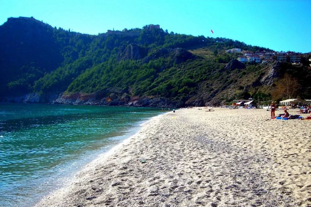 Beach with beautiful golden sand and mountains in Turkey