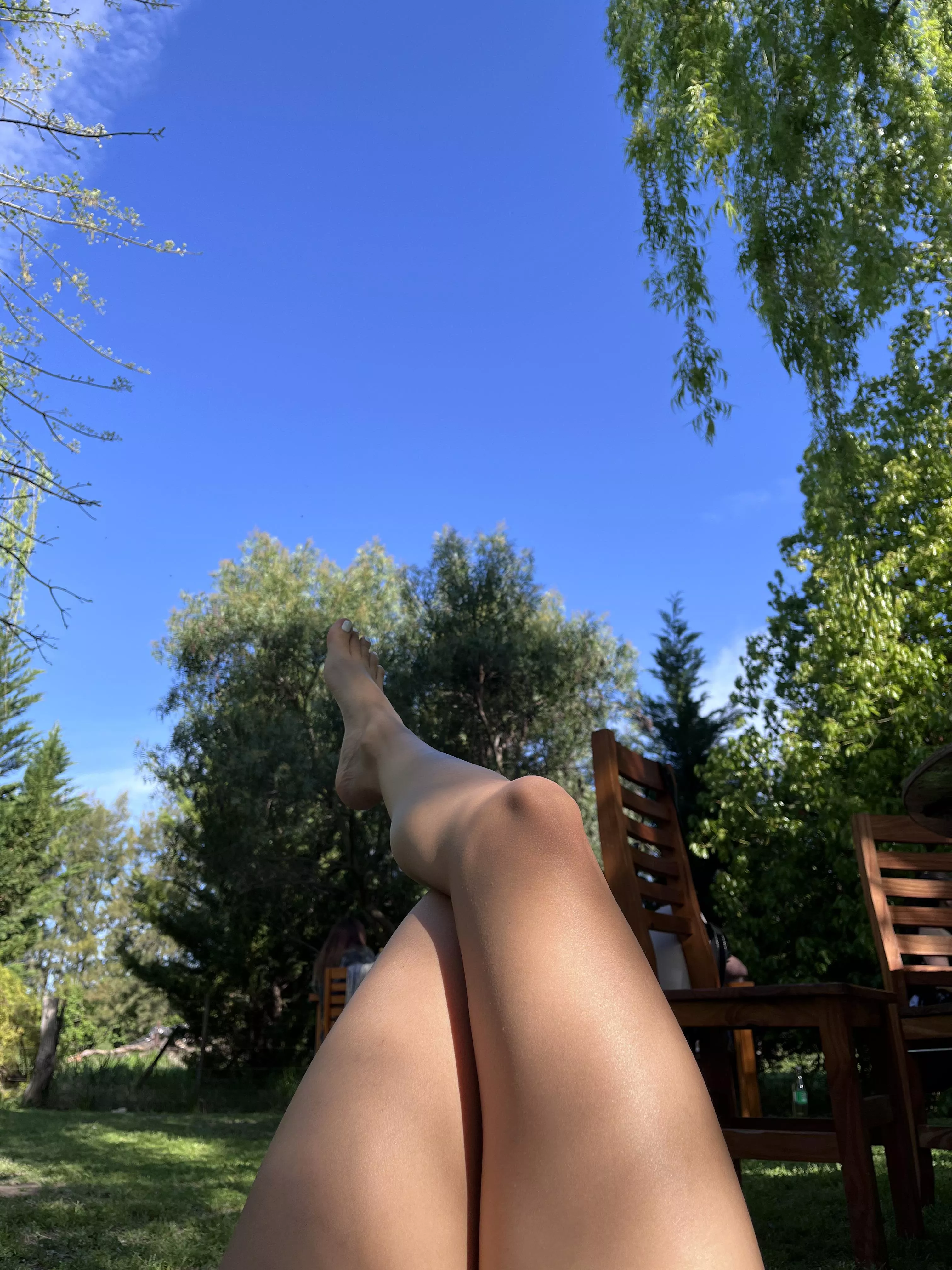 Chilling outdoors with my pretty legs and feet