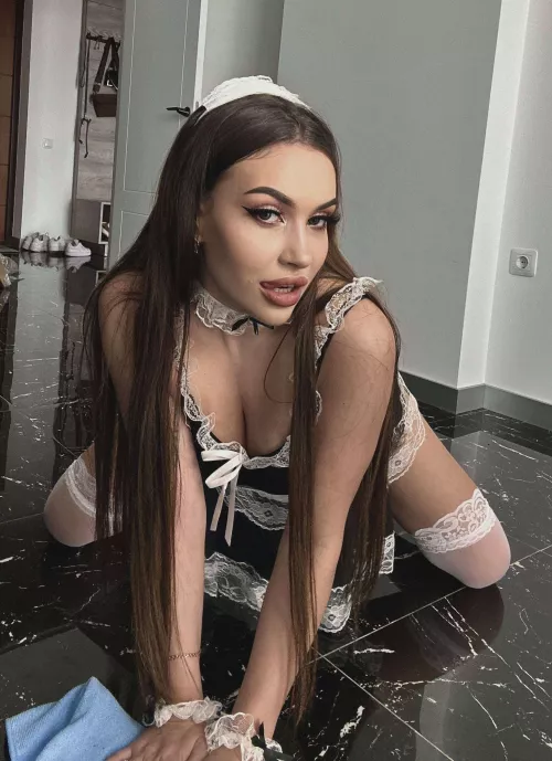 The brunette maid squatted