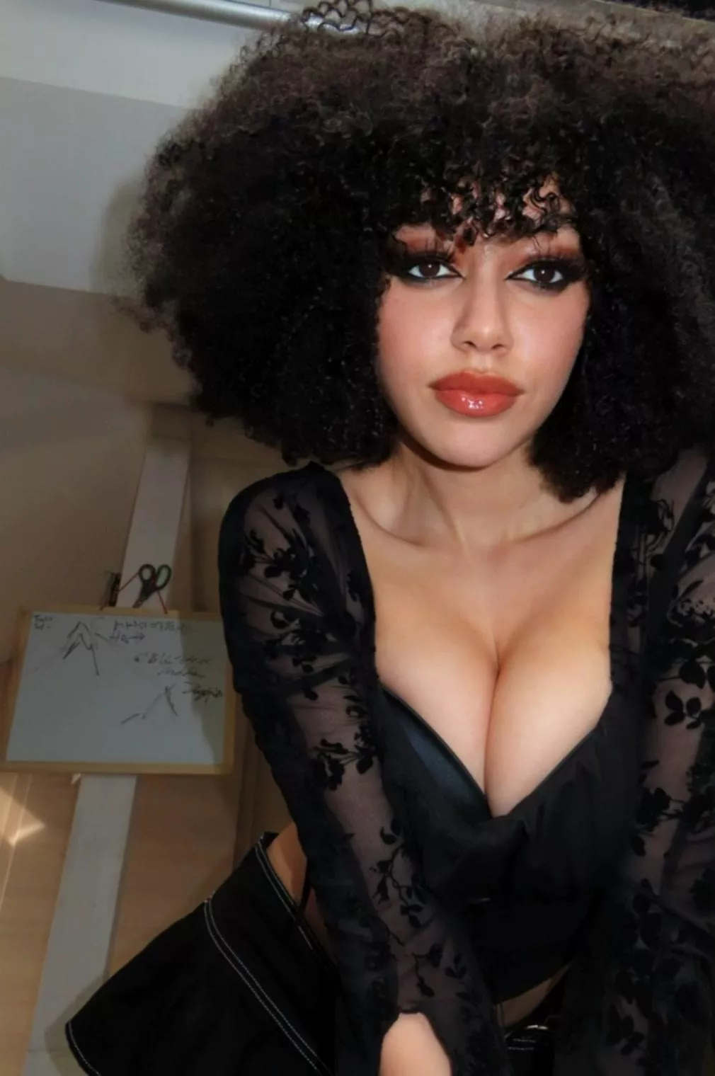 Sinful and sweet, a dark angel at your feet.