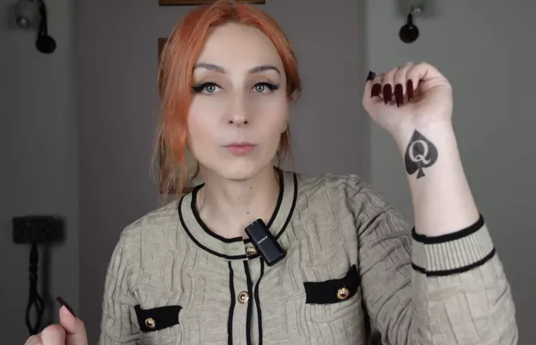 findom and luxury lifestyle mistress shows her temporary qos tattoo on her youtube video