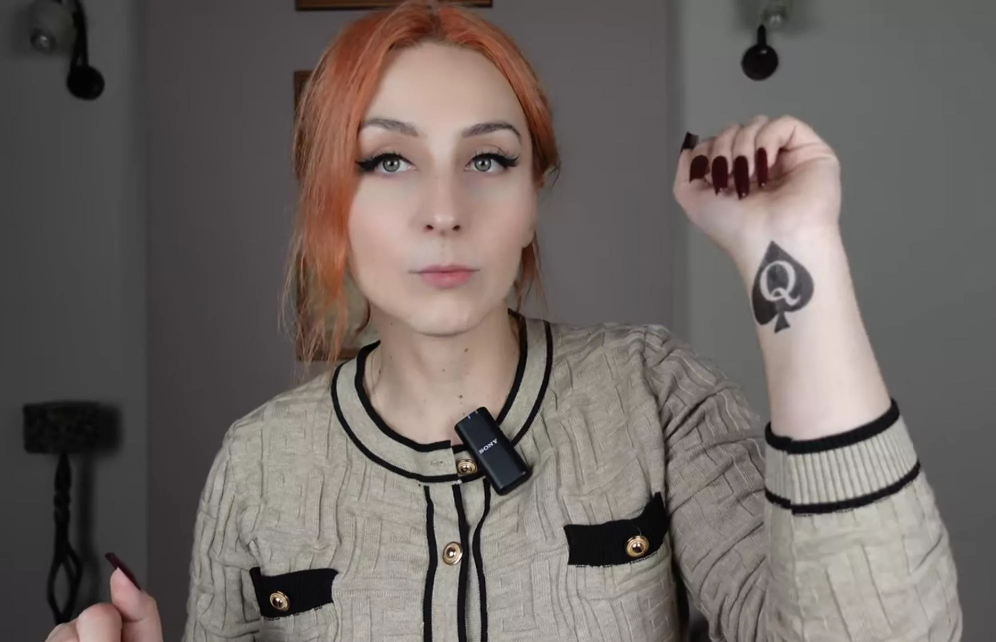 findom and luxury lifestyle mistress shows her temporary qos tattoo on her youtube video