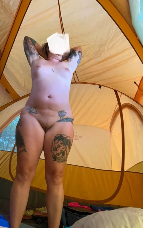 Morning stretches with the tent windows open are important before going outside 