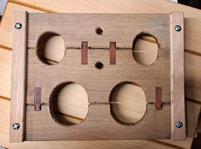 Compact portable 'stocks' - oak padauk - with rope option.