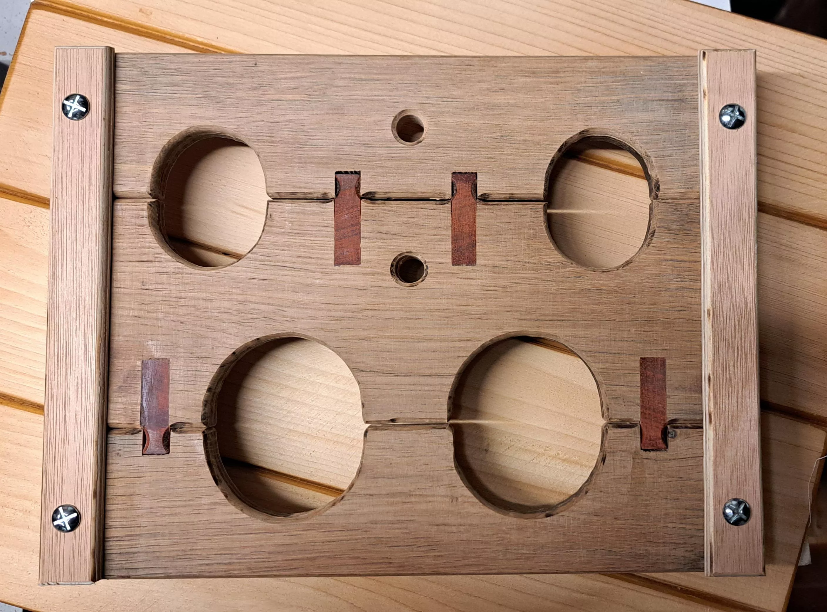 Compact portable 'stocks' - oak padauk - with rope option.