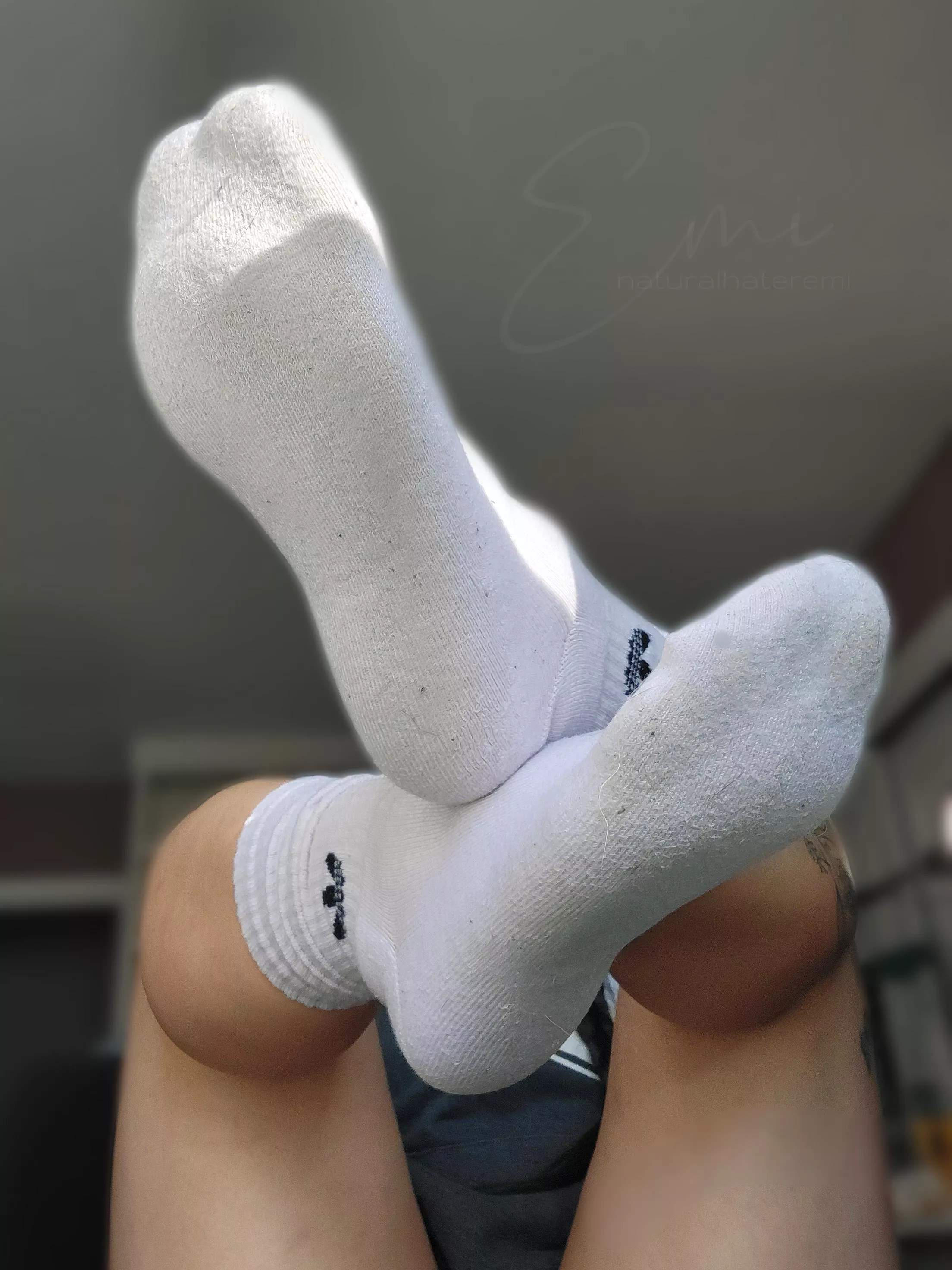 Dirty white gym socks with toe prints require immediate attention