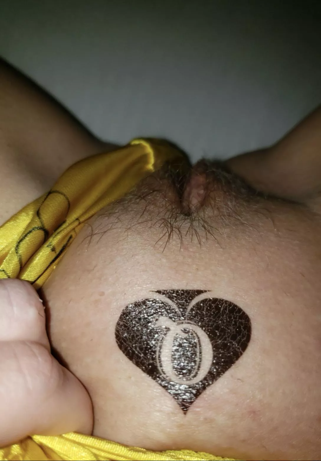 Just a temporary tattoo but it is still sexy to see.