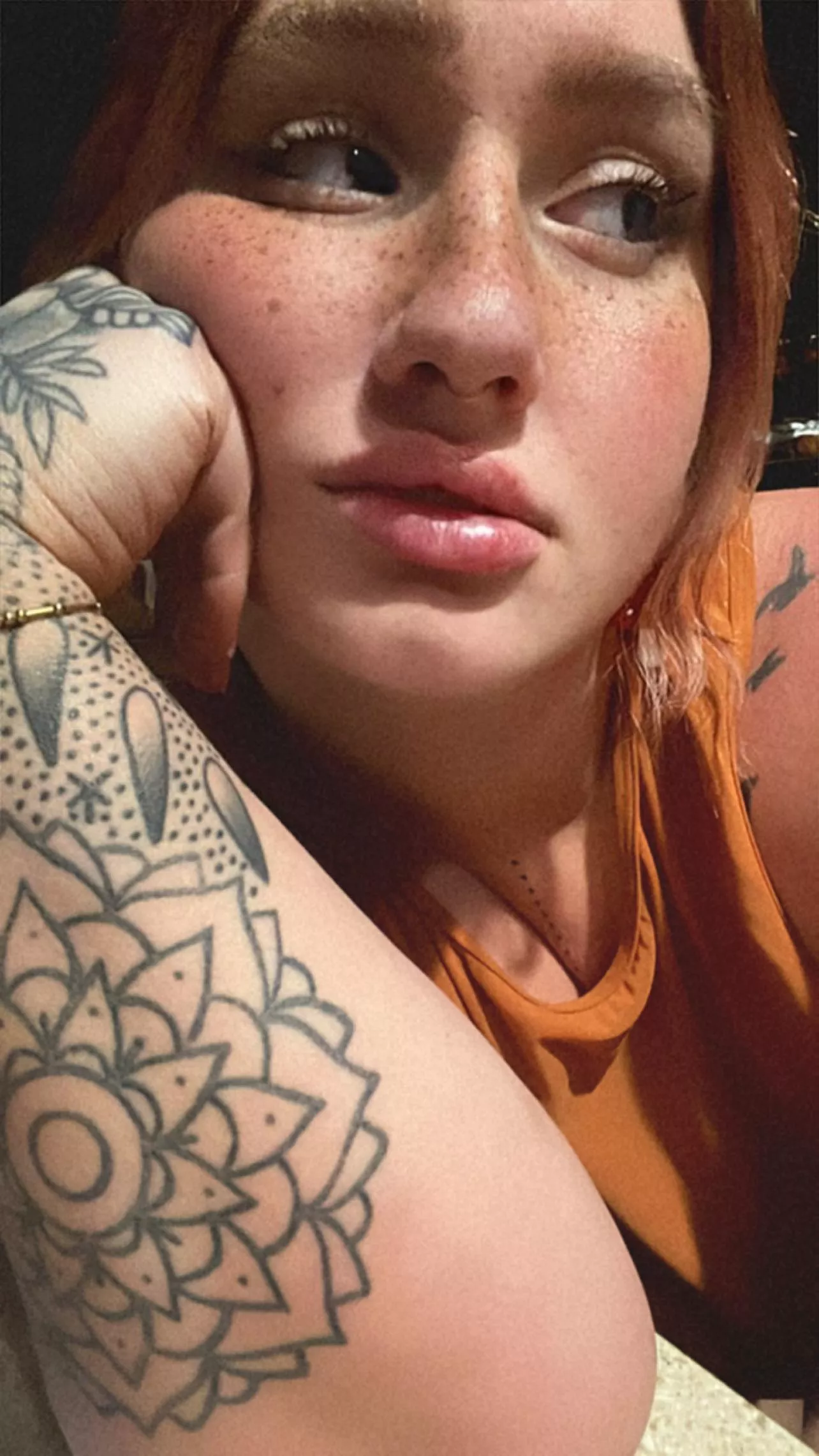 Red hair, tattoos, and curves for days