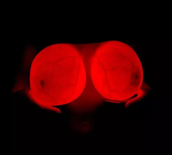 Big glowing implants in the dark