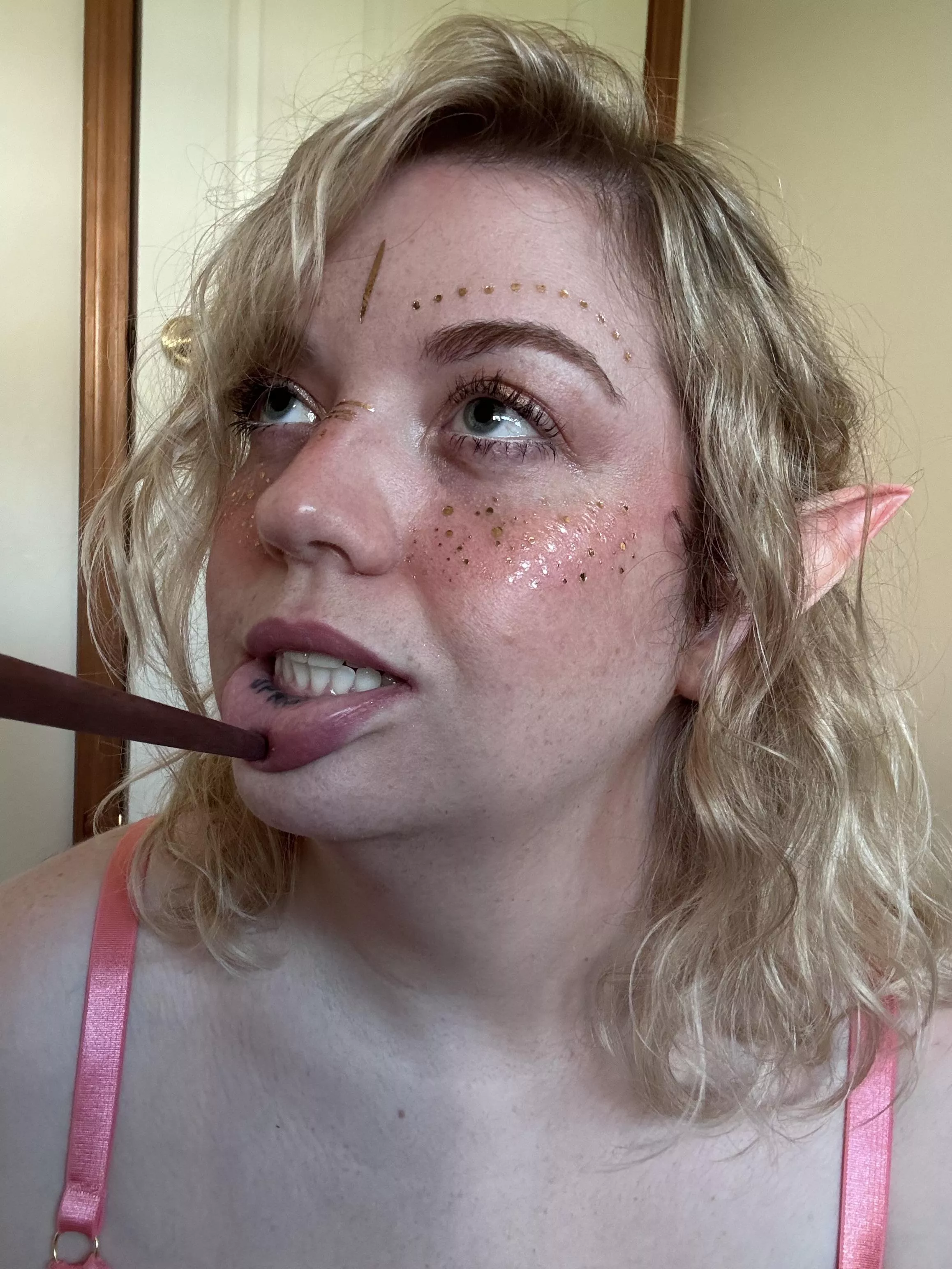 Can you make a riddle or a reason the party would need to find a word tattooed on an elf's lip?