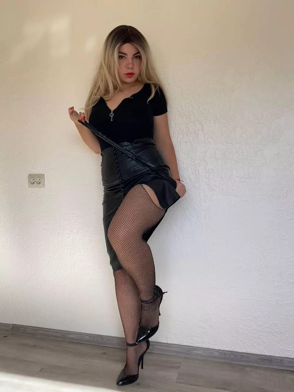 Great combination of heels and leather skirt