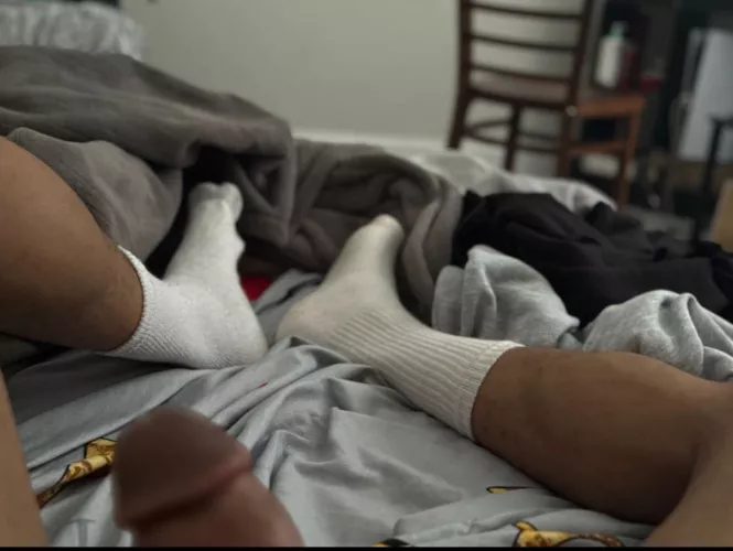 come on, give my big socked soles a good sniff 