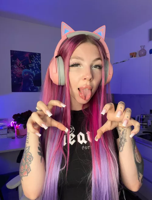 a cute gamer girl who looks like a kitty cat