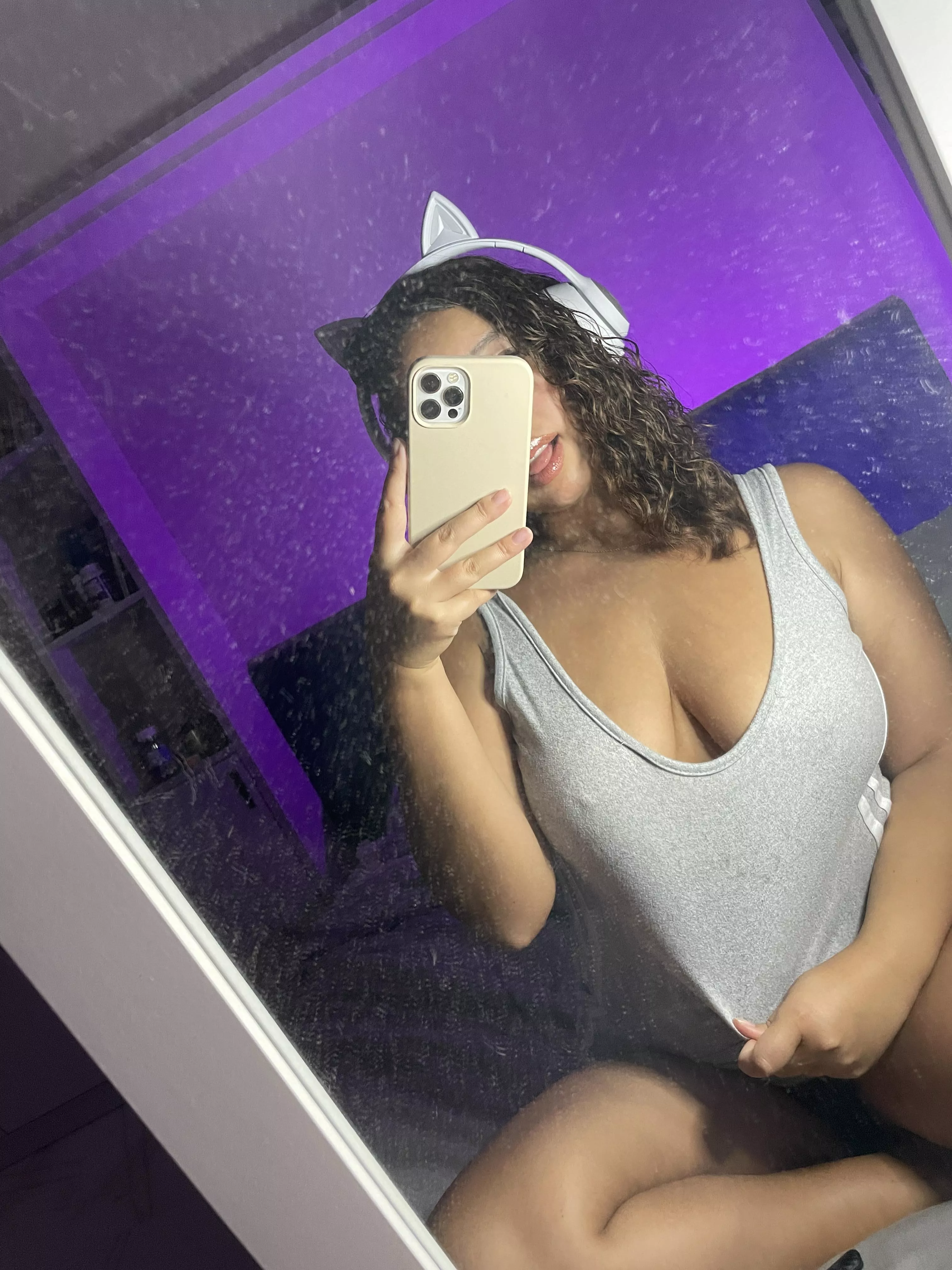 Curly girl in sleeveless shirt