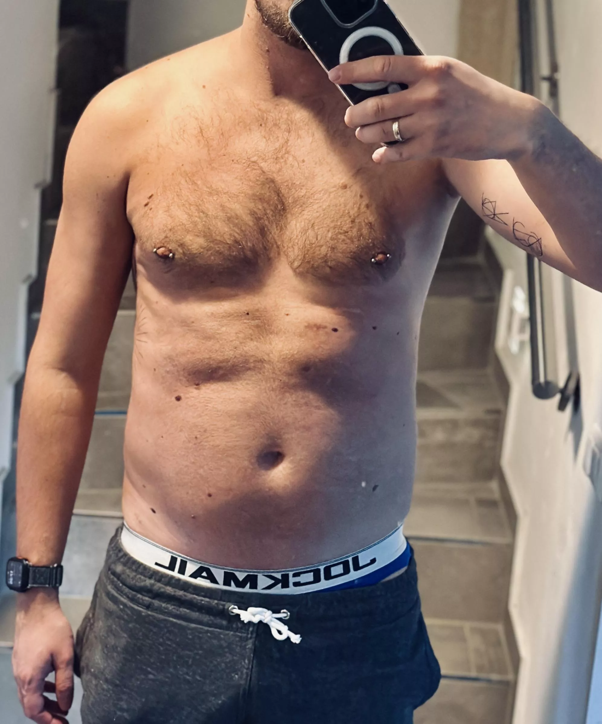 Pierced, tattooed, hairy 