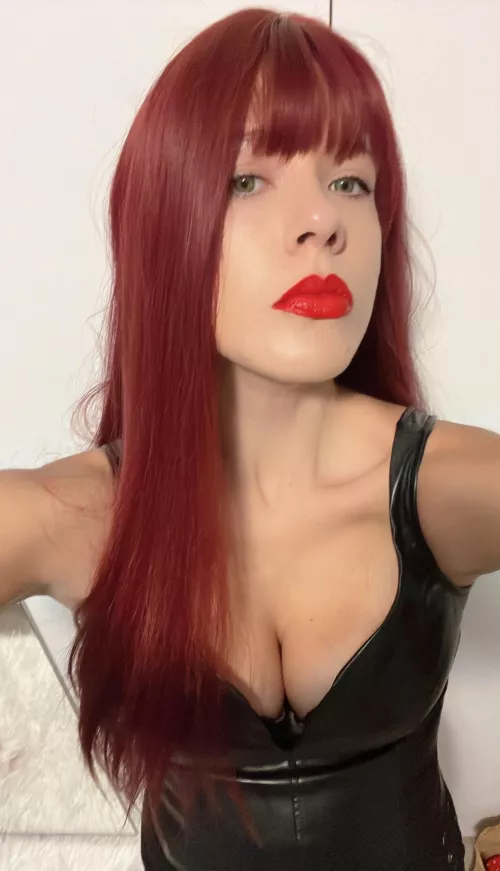 Bow before your queen. My fiery red hair matches the intensity of my gaze, and my authority is absolute. Obedience isn’t a choice—it's your only path to earn my favor. Submit fully, and perhaps you’ll be worthy of the privilege to serve me.