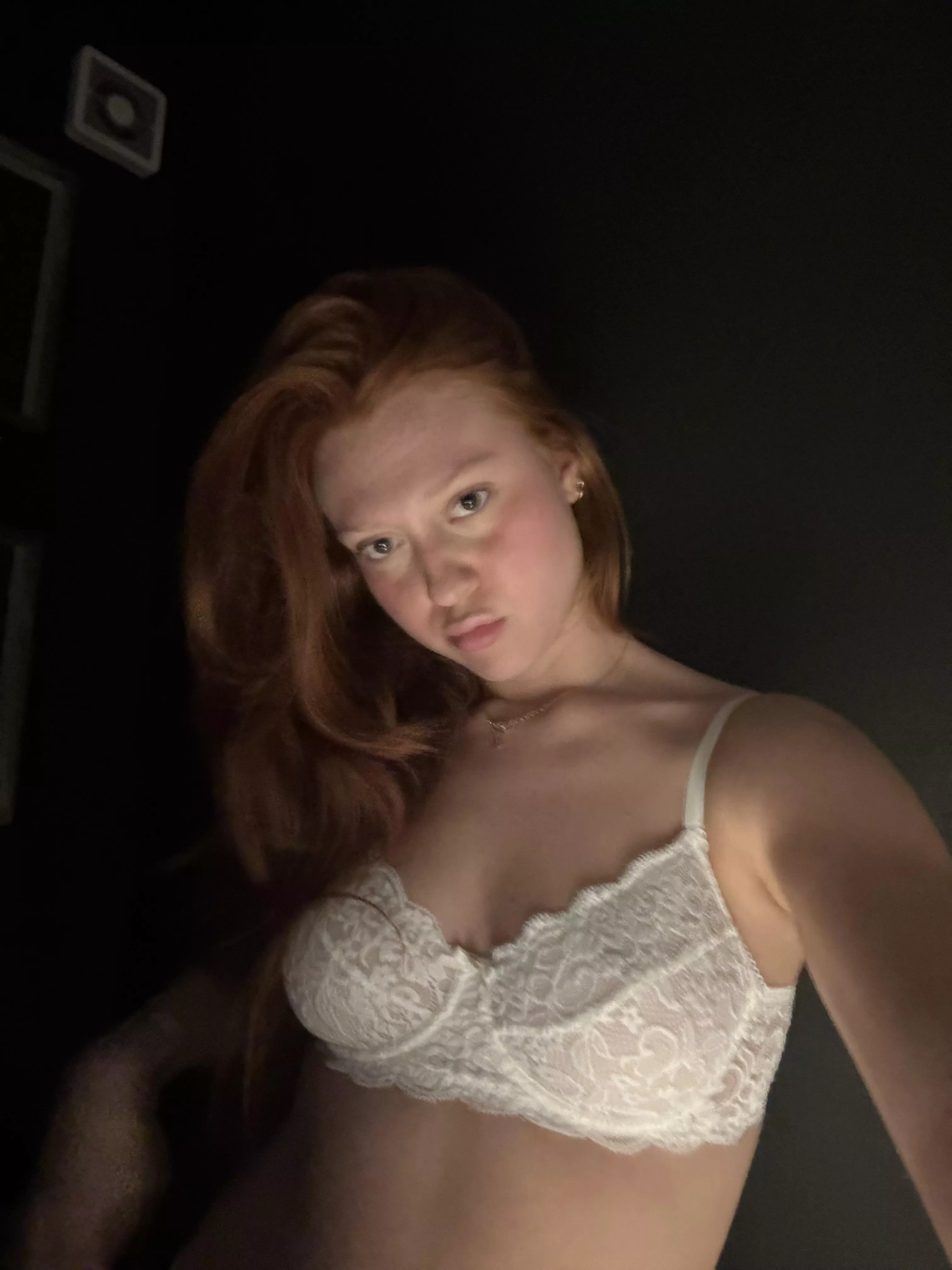 Just a lady in white lingerie , causing a little mischief.