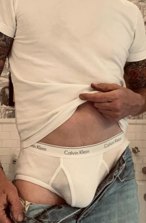 White t-shirt, button fly jeans and CKs. Great combo!