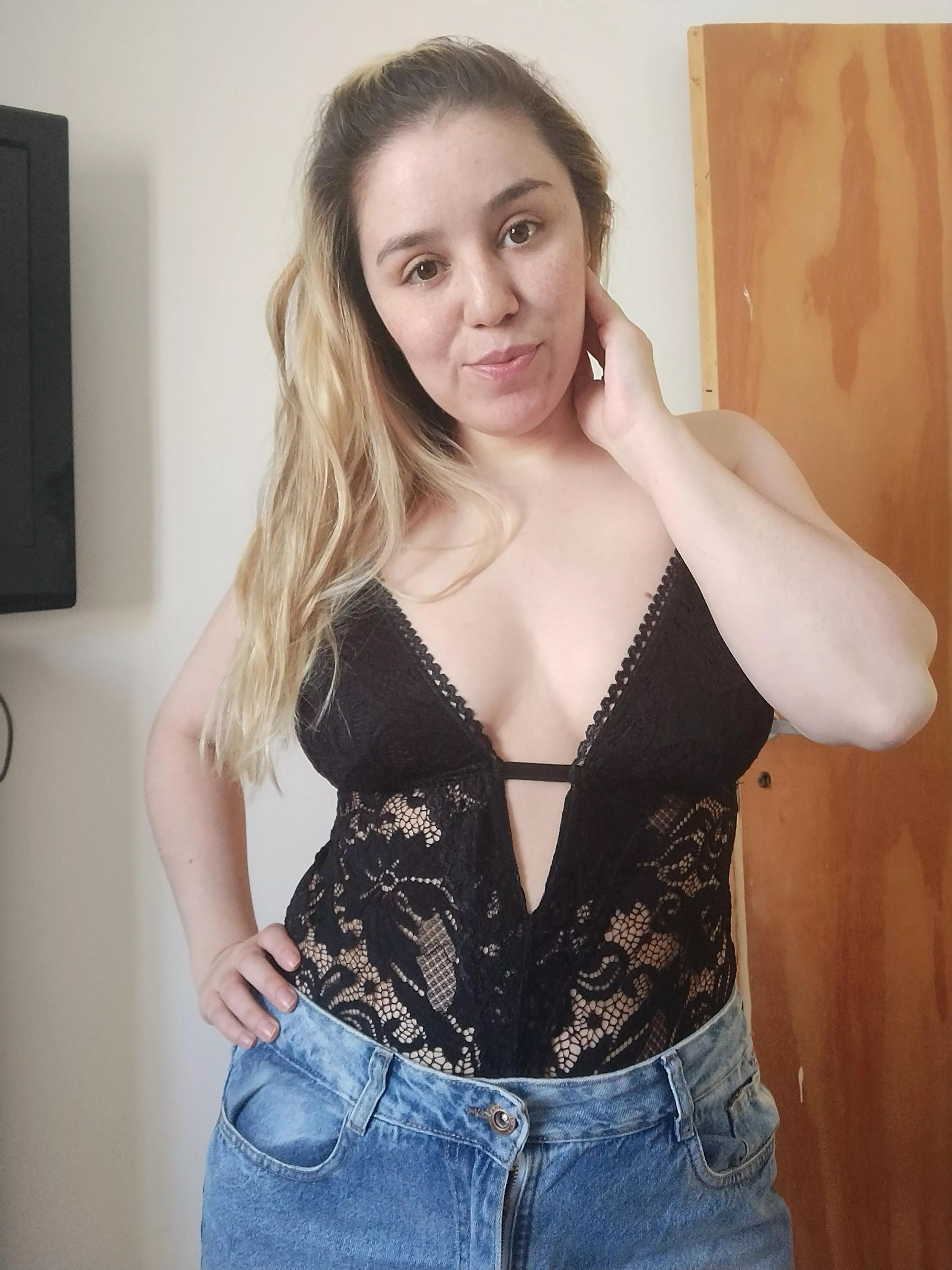 With a clean face and in jeans 