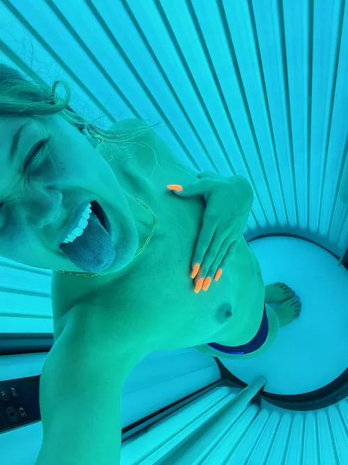 One boob and a naughty tongue.