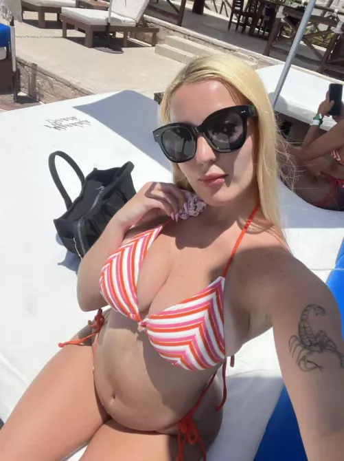 19 F catching rays—beach day or pool day for you?