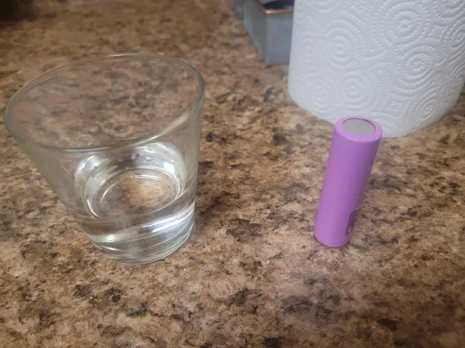 Dropped my 18650 in small water for a few seconds. Is it good or bad? See photo to see how much