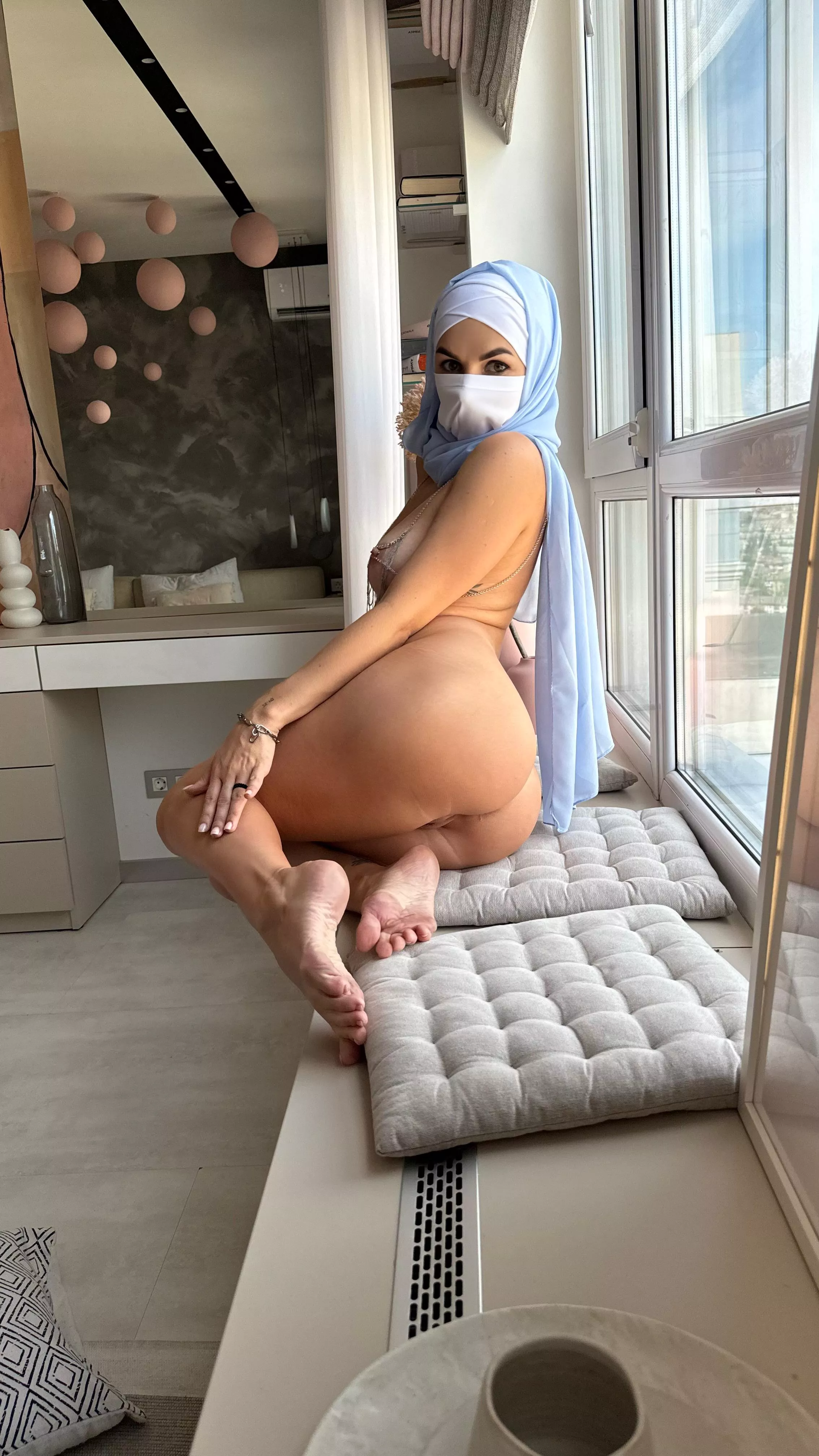 I love being completely naked at the window, especially when the neighbors are looking at me