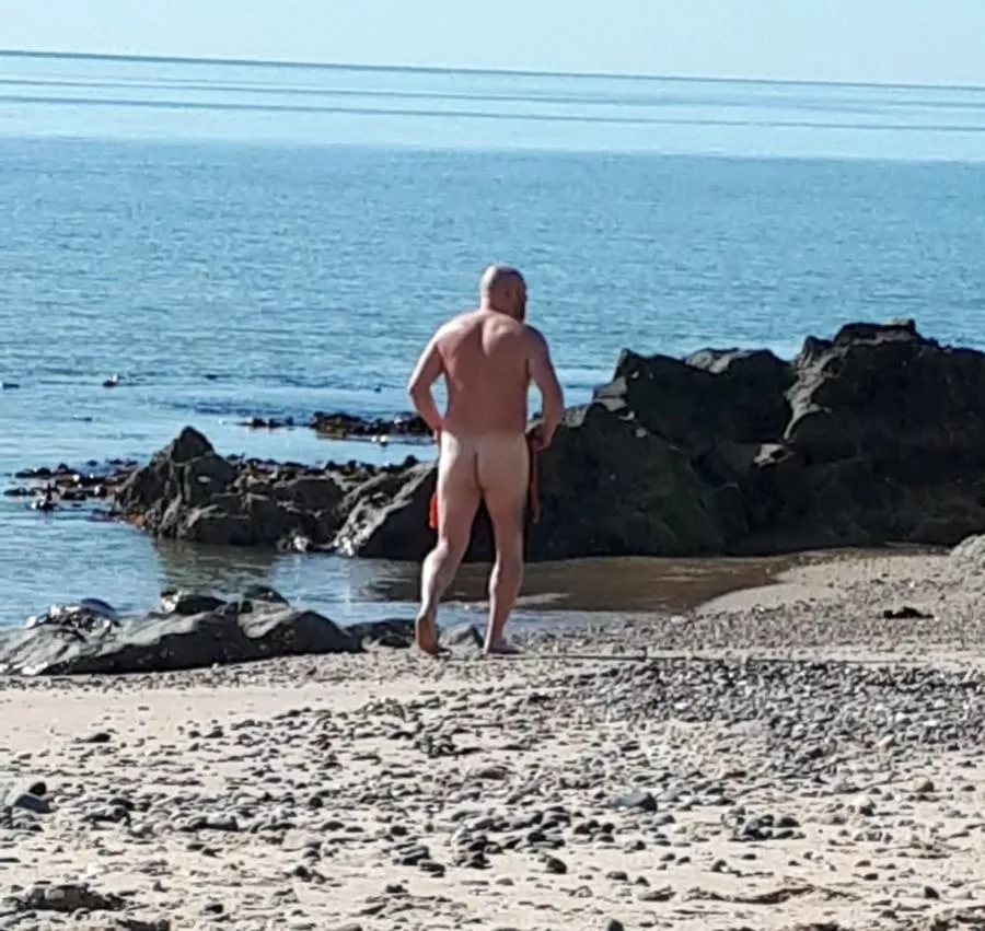 Naked stroll along a local strand 