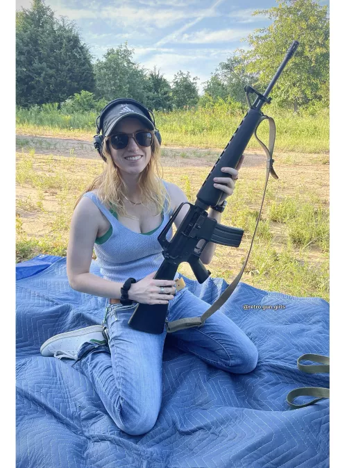 Blonde girl with Colt Sporter AR15 