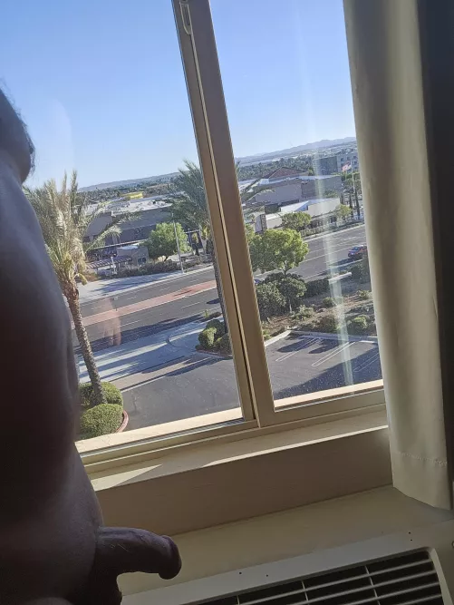 Suitcase unpacked, drink made, windows open, clothes off