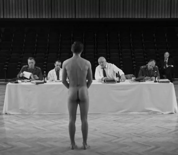 Team of men determine whether guy is fit for military service